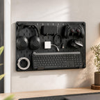Wall-mounted 22×16 inch desk organizer pegboard for storing keyboard, headphones, controller, mouse and charging cables.