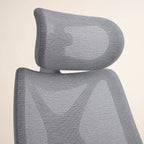 Aster executive chair headrest and upper mesh backrest detail