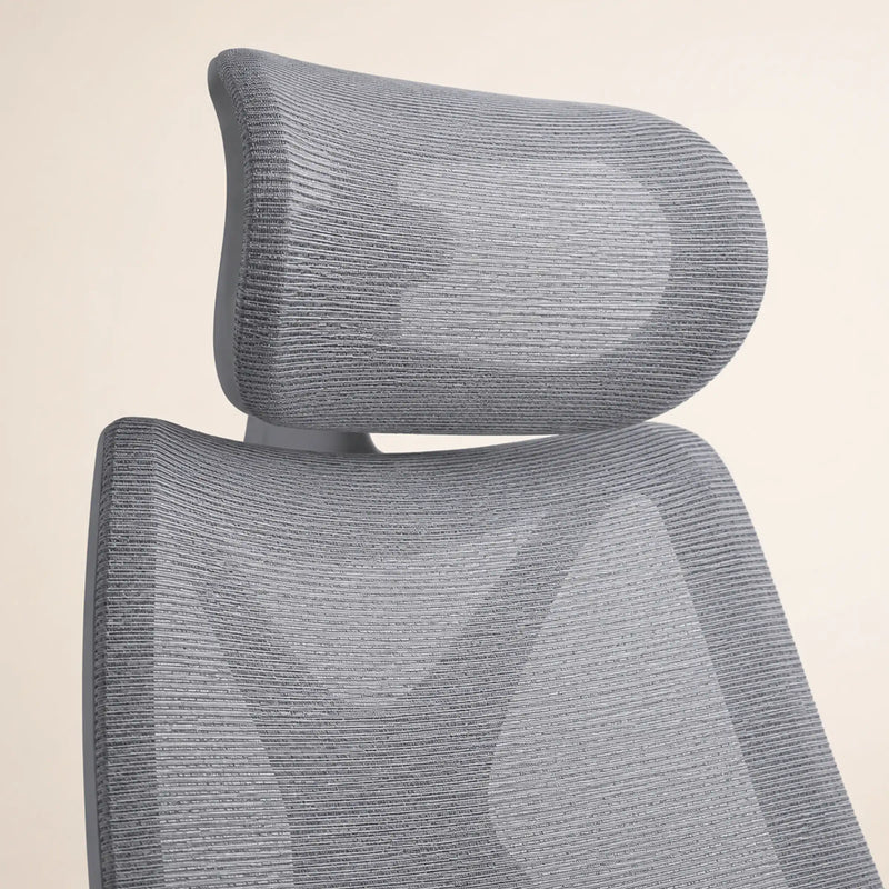 Aster executive chair headrest and upper mesh backrest detail