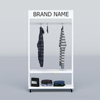 Modern garment display stand with white steel frame, stainless hanging tube and shelves for folded clothing items.