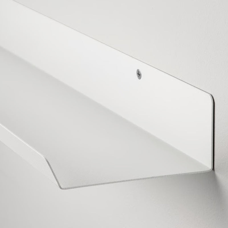 Malmback Display shelf holding picture frames on a modern white wall