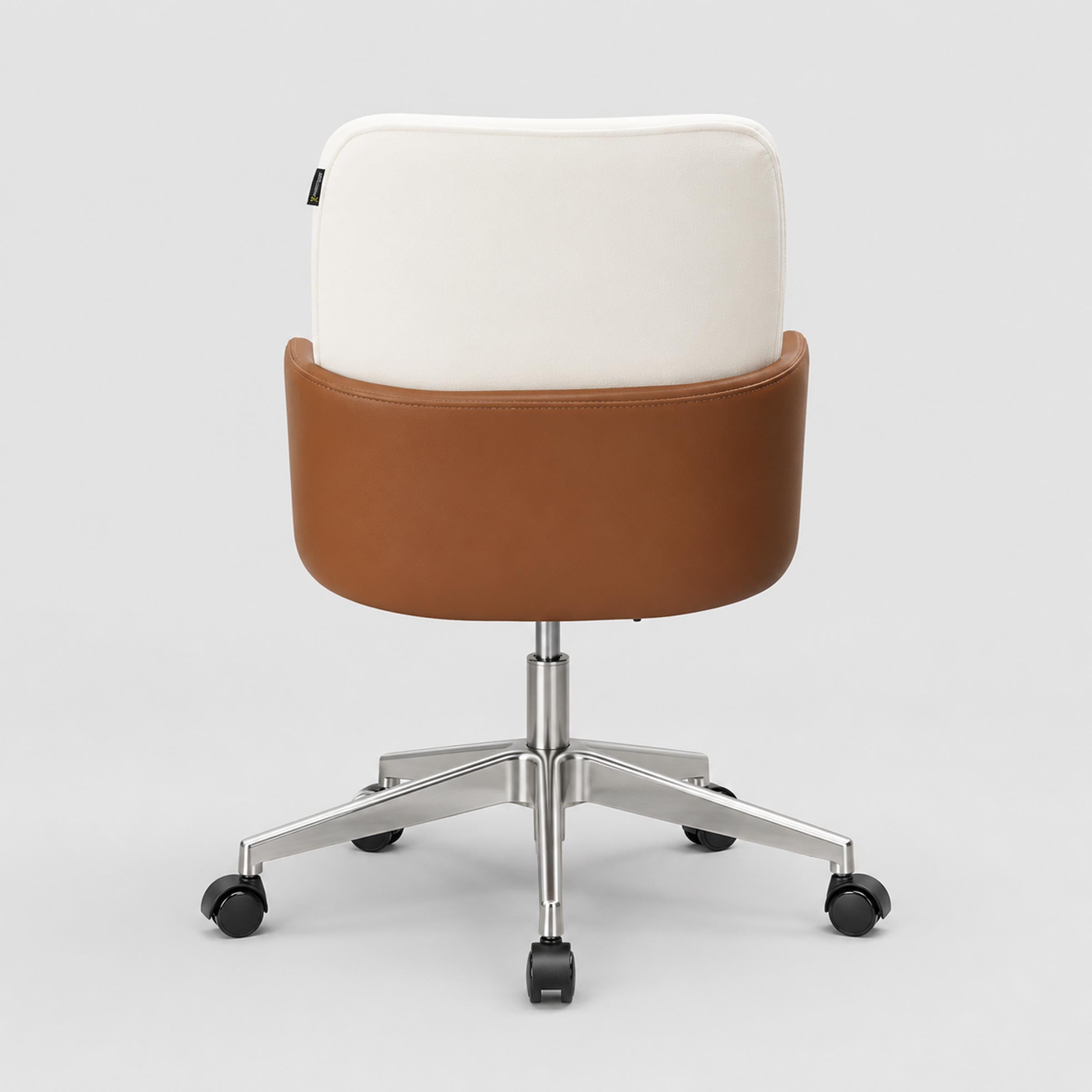 Ergonomic Milo executive chair with high back, padded cream fabric, tan arm supports and adjustable swivel caster wheels