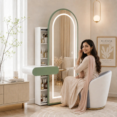 Arched LED dressing table-এর সামনে বসে থাকা এক বাংলাদেশি নারী, সফট নিউট্রাল ইন্টেরিয়রে প্রিমিয়াম vanity setup.