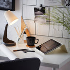 SVALLET Work Lamp black and white modern desk light for reading, study, bedside and workspace use in small spaces.