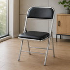 Shai Folding Chair with black cushioned seat, chrome metal frame and foldable design for home and office use.