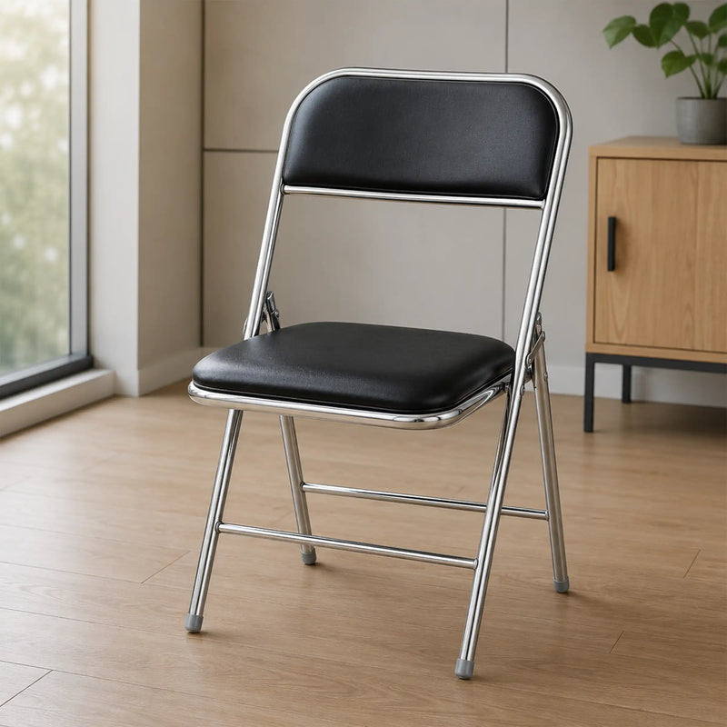 Shai Folding Chair with black cushioned seat, chrome metal frame and foldable design for home and office use.