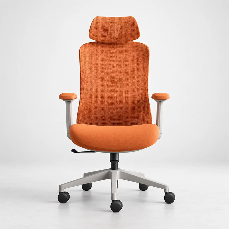 An orange fabric office chair with a headrest, armrests, and a silver five-star base on a light gray studio background.
