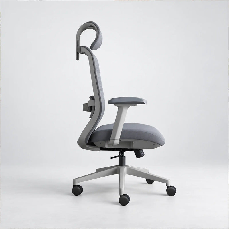 A modern ergonomic office chair with a curved gray fabric backrest, matching gray armrest, padded seat, and a silver five-star wheeled base, shown against a plain light gray studio background.