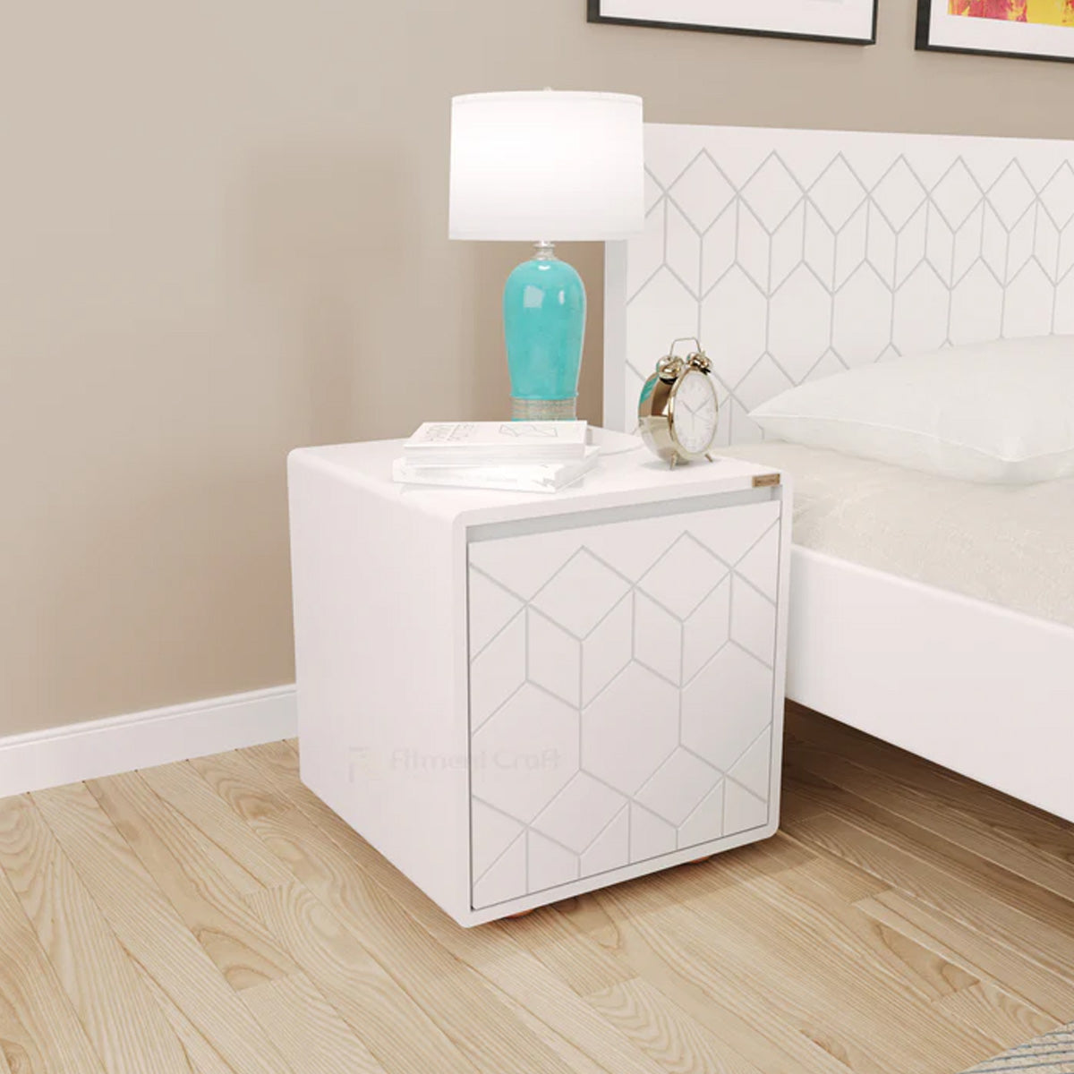 White Astro bedside cabinet with geometric door pattern and lamp beside a bed