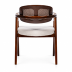 Rear view of Auden lounge armchair showing woven back panels and curved wooden rail