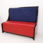 Blueberry sofa with blue padded back, red seat and curved brown sides