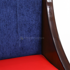 Close view of Blueberry sofa blue back upholstery, red seat and curved brown side