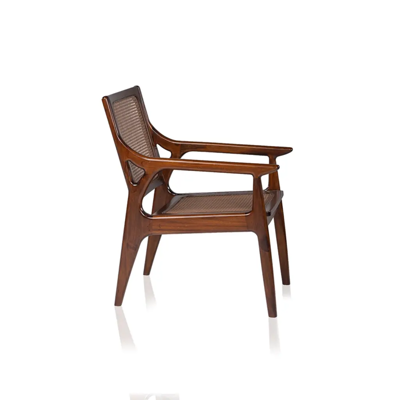 Side view of Briar Classic wood and PVC rattan lounge chair showing curved armrests and angled woven back
