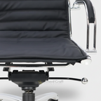 Close view of Confidence chair ribbed seat, armrest and under-seat adjustment mechanism