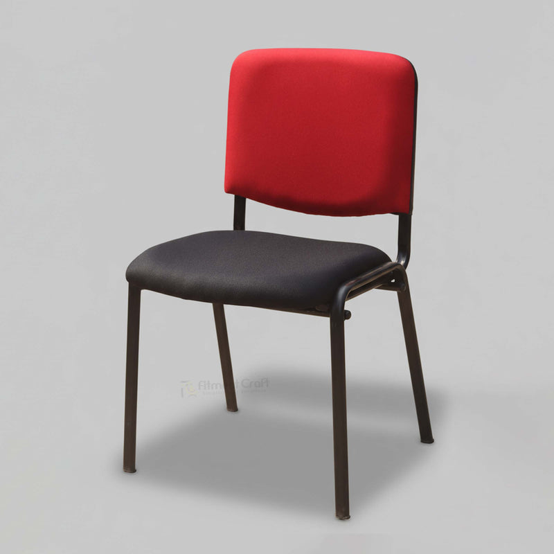 Crux visitor chair with red back, black seat and dark frame, front angled view