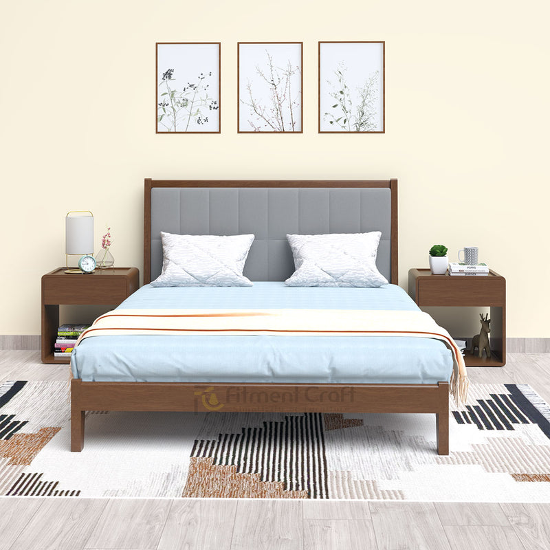 Brown DreamScape bed with grey padded headboard and matching bedside tables in a room