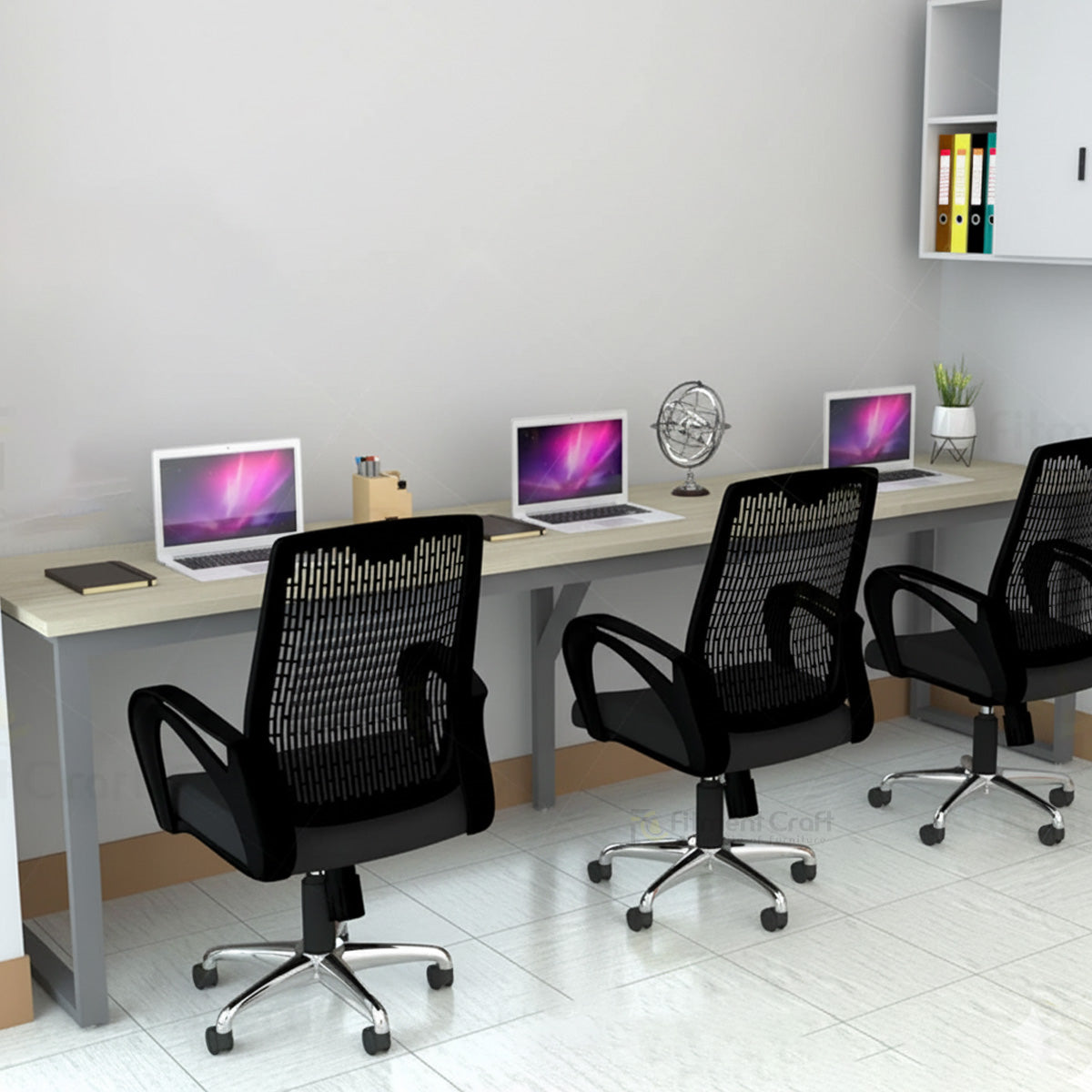Eclectic workstation with laptops and three black mesh chairs, close angled view