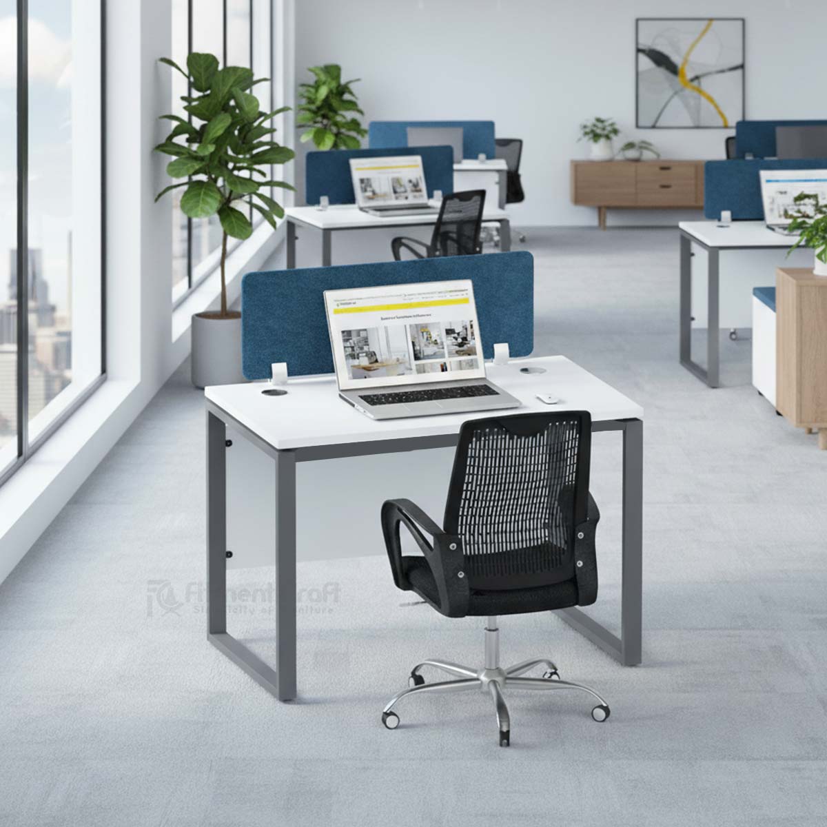 Flexi single-person workstation with blue divider, laptop and black chair in an office
