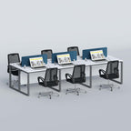 Flexi six-person workstation with laptops and six black office chairs