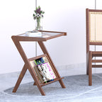 Brown Frostelle side table with crossed legs, tray-style top and angled magazine shelf