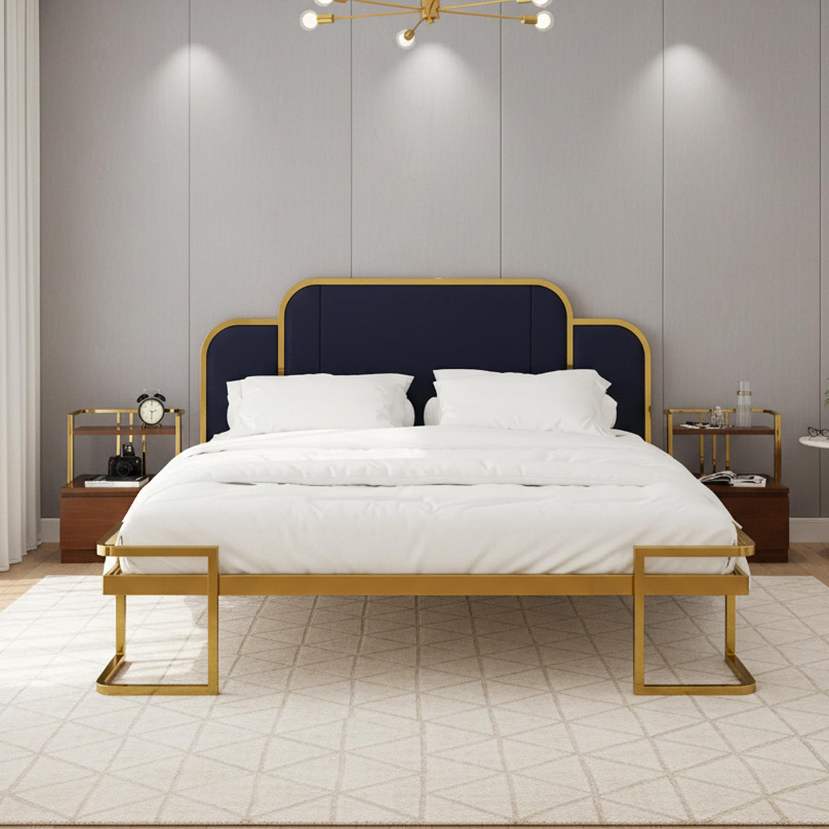 Grand bed with dark padded headboard, gold-coloured frame and white bedding