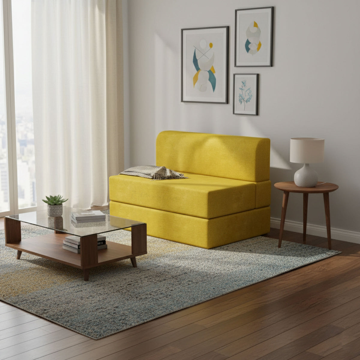 Mustard yellow Lorien sofa bed beside a coffee table in a living room