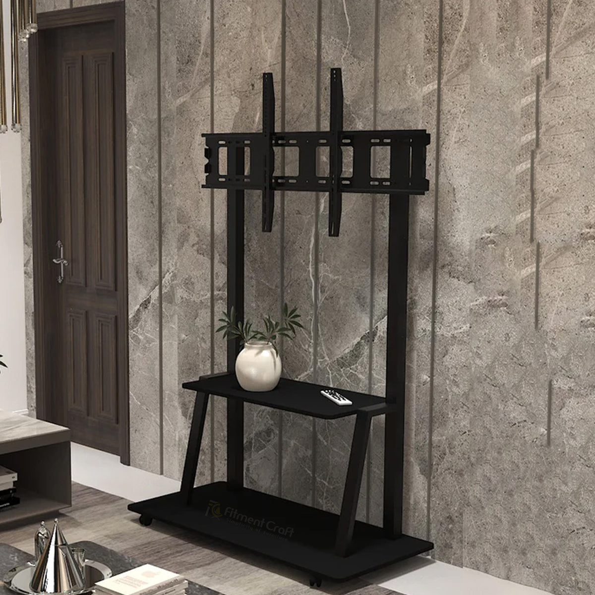 Black Majestic TV stand with mounting bracket and lower shelf beside a wall