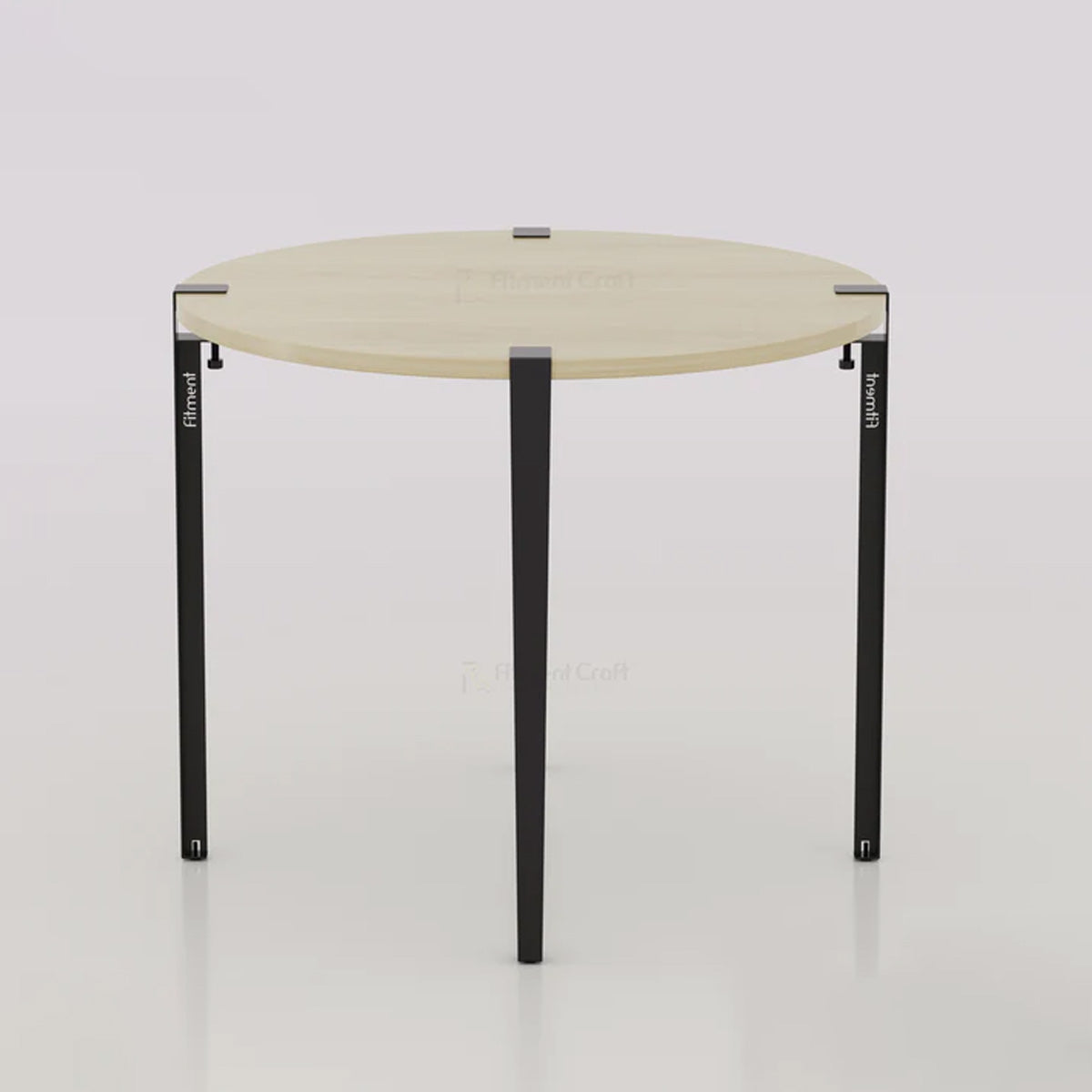 Orba round table with pale wood-tone top and black legs, overhead angled view