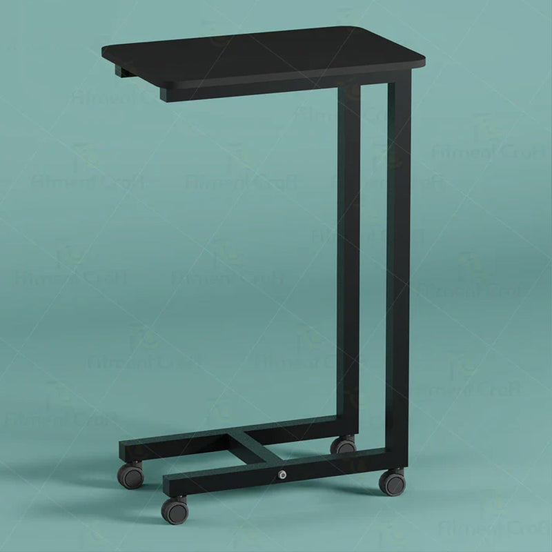 Black overbed table with caster wheels, front angled view
