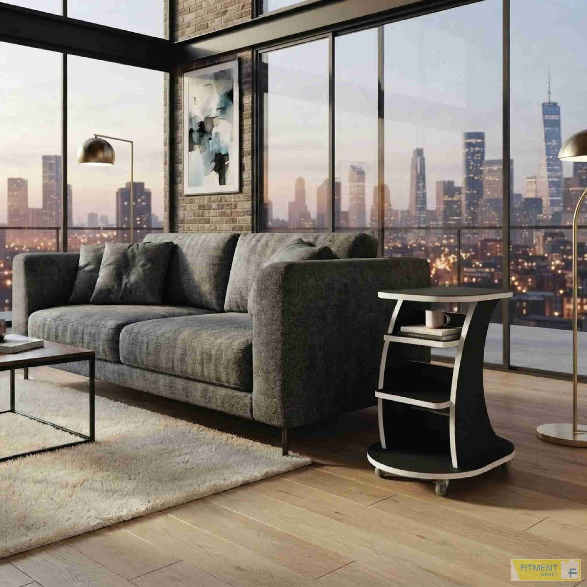 Wagon center table in black with white edging beside a grey sofa, with books and a cup on its shelves