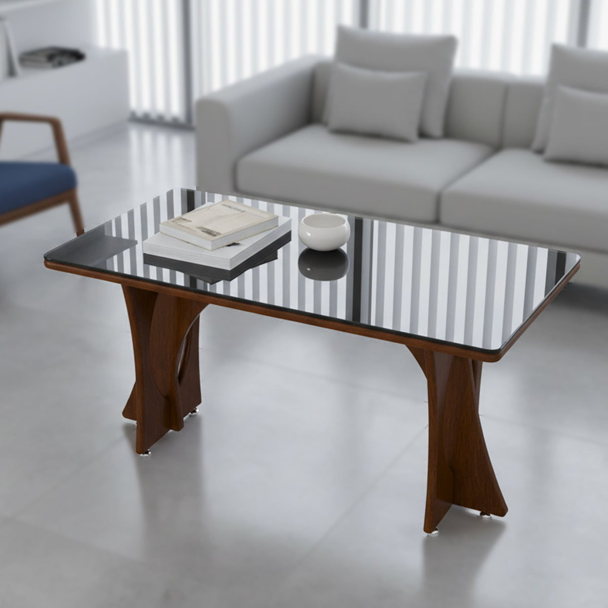 Rayzo center table with reflective dark top and sculpted brown legs in a living room