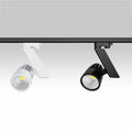 White and black Resly track spotlights mounted on a black lighting rail