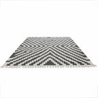 Black and white Rova rug with chevron pattern and fringed edges