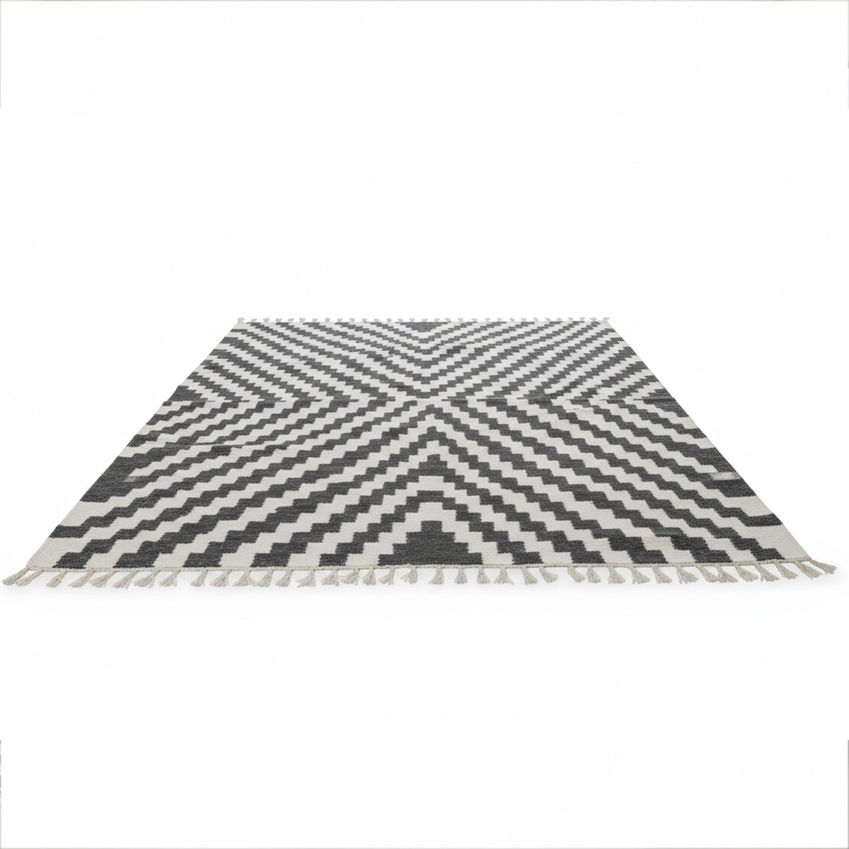 Black and white Rova rug with chevron pattern and fringed edges