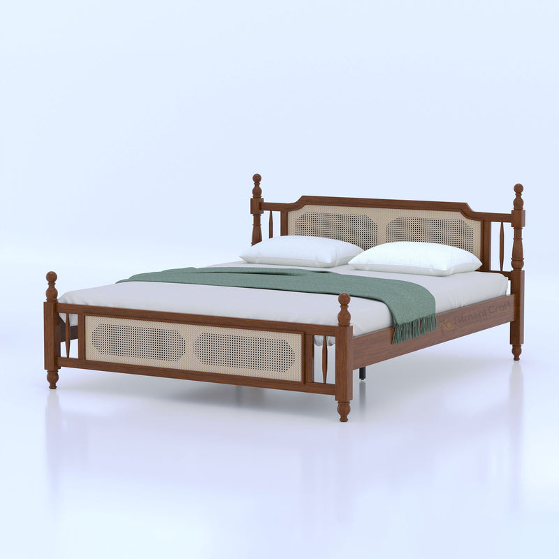 Brown Signature bed with turned posts and pale inset panels, opposite angled view