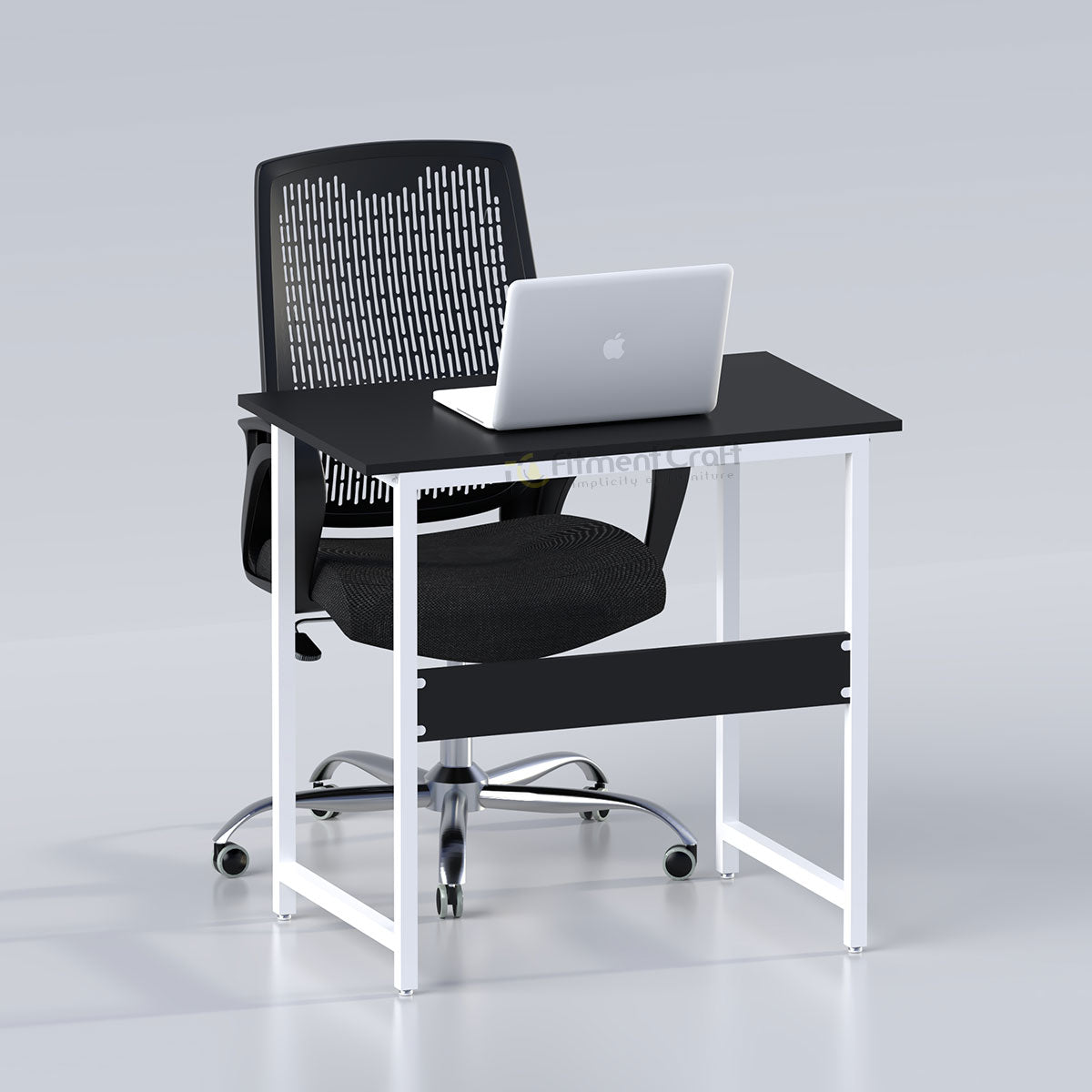 Sleek desk with black top, white frame and black chair, staged with a laptop