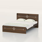 Brown Victorian bed with pale diamond headboard and footboard patterns and light bedding