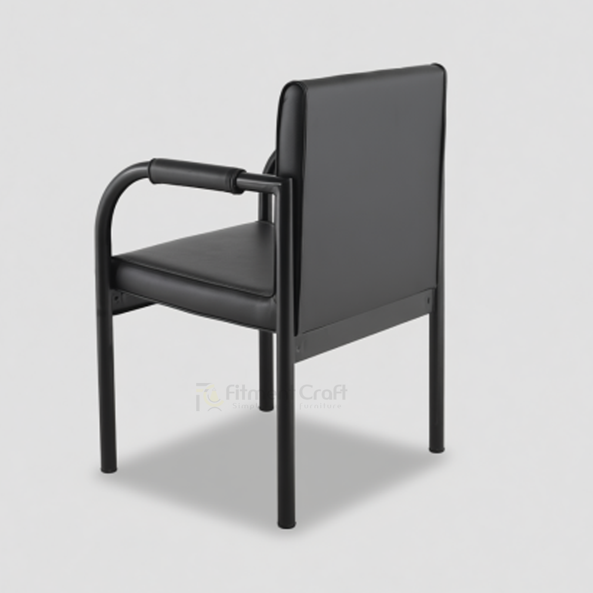 Black Vizio visitor chair with curved arms and padded back, rear angled view