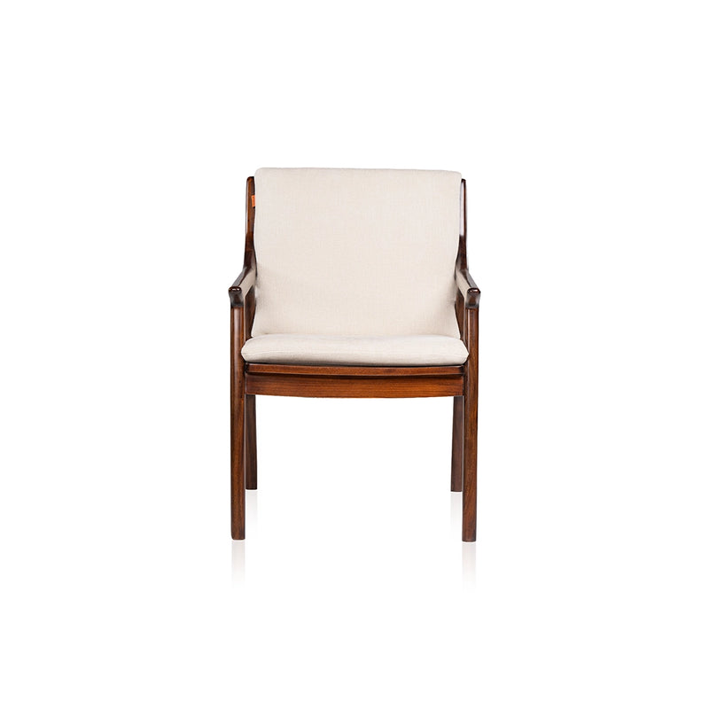 Front view of the Walden single seater sofa with cream cushions, narrow wooden arms, and a brown wooden frame.
