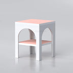 White and pink Vacy side table with arched openings and lower shelf