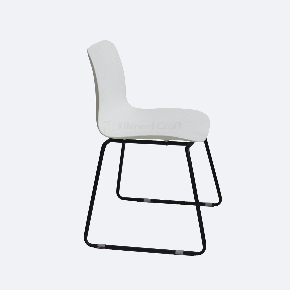 White Cathedra chair side view with curved seat and black sled legs