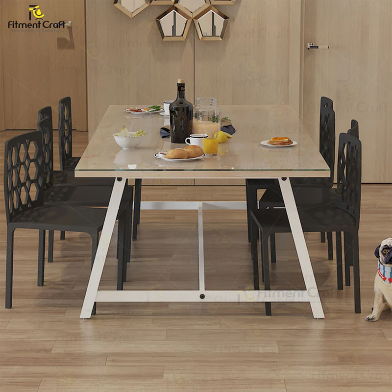 Yum dining table with light top and white frame surrounded by black chairs